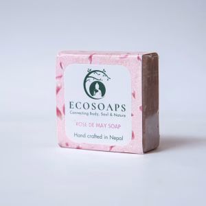 a pink soap bar with a white label